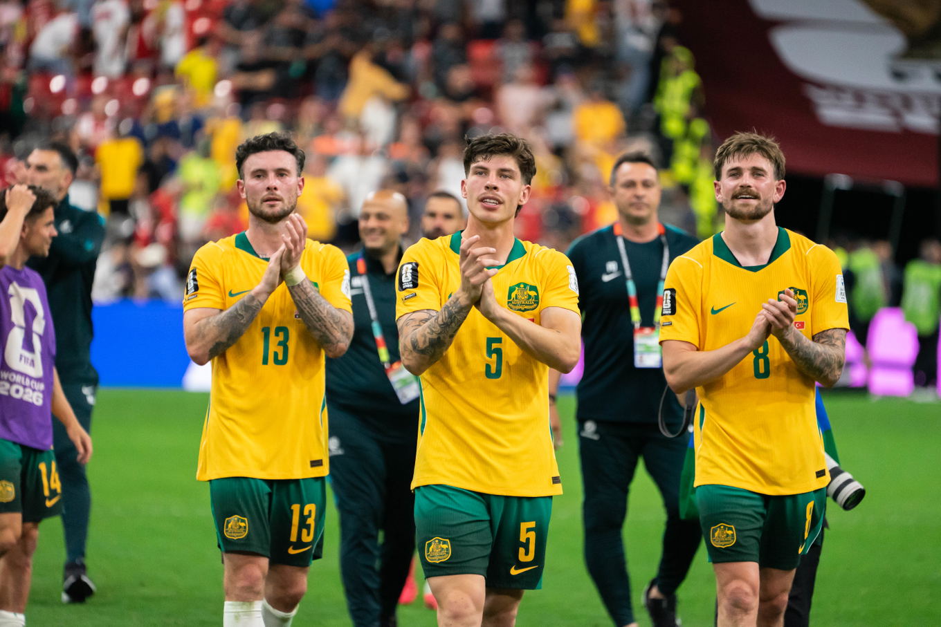 VANCOUVER, CANADA - JUNE 13: Jordan Bos of Australia, Connor Metcalfe of Australia and Aiden O'Neill of Australia celebrate after winning the FIFA World Cup 2026 group stage match between Australia and Turkey at BC Place Stadium on June 13, 2026 in Vancouver, British Columbia, Canada. 