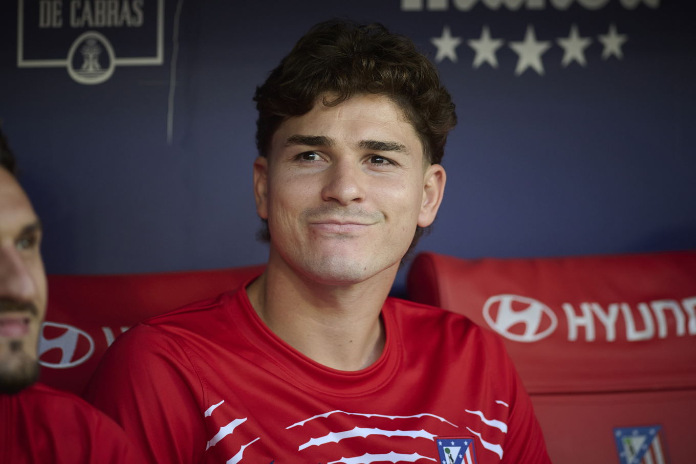 Julián Álvarez of Atlético Madrid sits on the bench during the La Liga match against Real Madrid