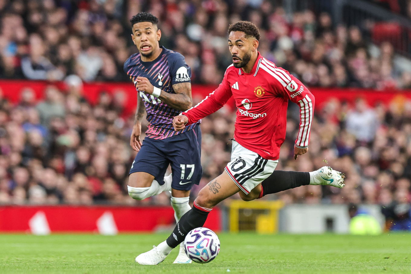 Matheus Cunha of Manchester United breaks with the ball during the Premier League match against Tottenham Hotspur at Old Trafford