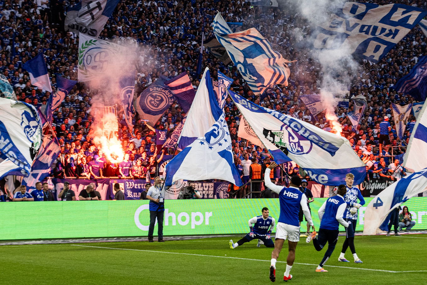 Schalke 04 fans light pyrotechnics during the warm-up before the 2. Bundesliga match against Fortuna Düsseldorf at the Veltins-Arena