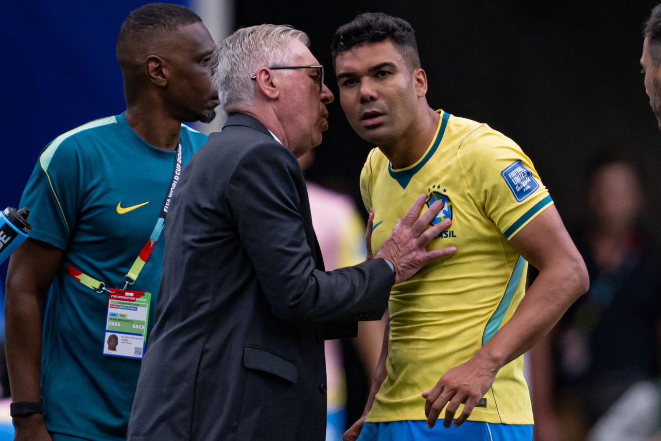 Brazil head coach Carlo Ancelotti talks to Casemiro during the FIFA World Cup 2026 round of 32 match against Japan in Houston
