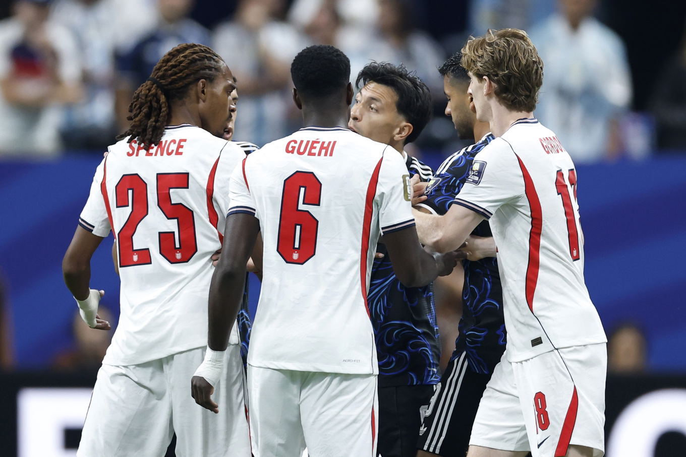 England's Djed Spence, Marc Guéhi and Anthony Gordon argue with Argentina's Lisandro Martínez and Julián Álvarez during the FIFA World Cup 2026 semi-final in Atlanta