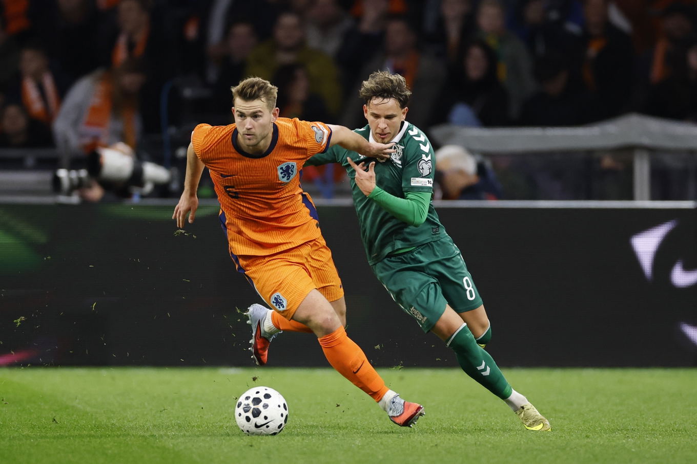 Matthijs de Ligt of the Netherlands and Tomas Kalinauskas of Lithuania during the 2026 World Cup qualifier at the Johan Cruijff ArenA in Amsterdam
